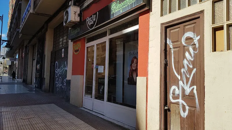 Vela Peluqueros
